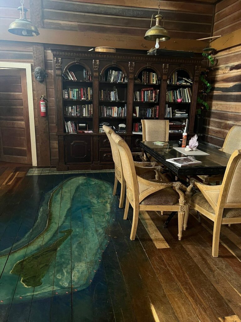 Interior of Itza Lodge Belize with hand-painted Lighthouse Reef Atoll floor map