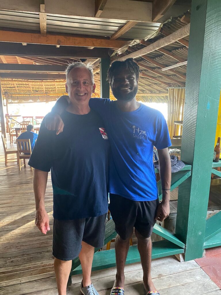 Dive master with guest at Itza Resort Lighthouse Reef Belize showing personal dive experience and small group diving