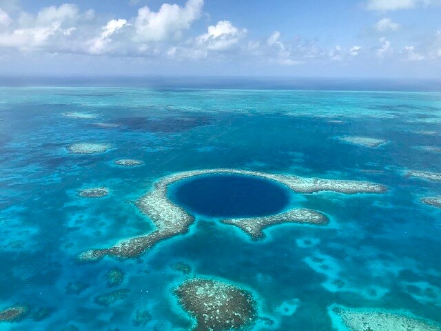 Aerial view of the Great Blue Hole in Belize at Lighthouse Reef Atoll