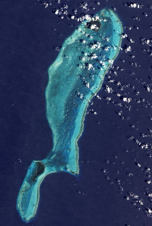Satellite view of Lighthouse Reef Atoll in Belize showing the Great Blue Hole and surrounding coral reef structure in the Caribbean Sea